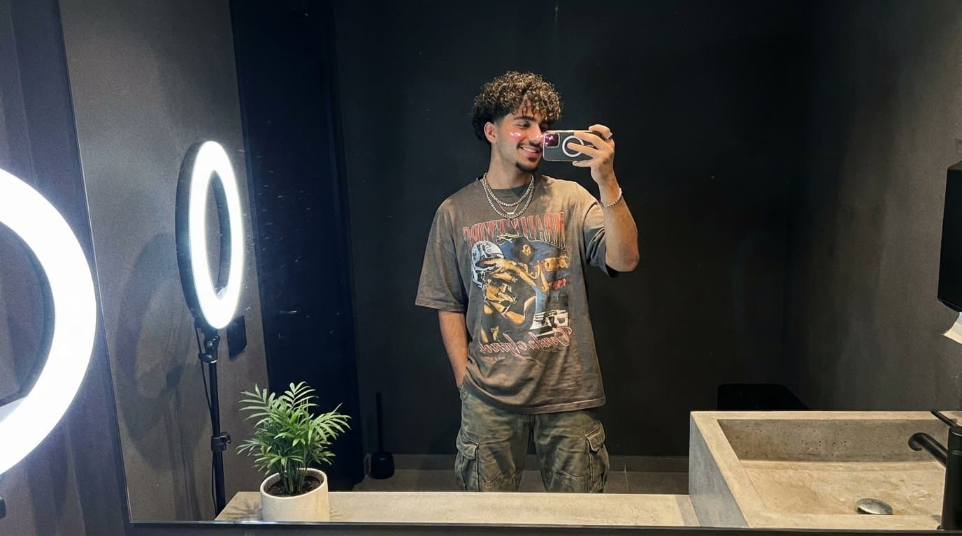 Young man with zoomer perm taking mirror selfie in modern bathroom, TikTok influencer aesthetic with ring light